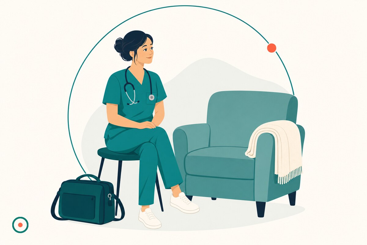 Female nurse in teal scrubs beside a softly lit armchair, folded cream blanket, and a home-visit nursing bag